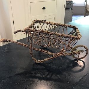 Adorable willow and wire wheelbarrow.